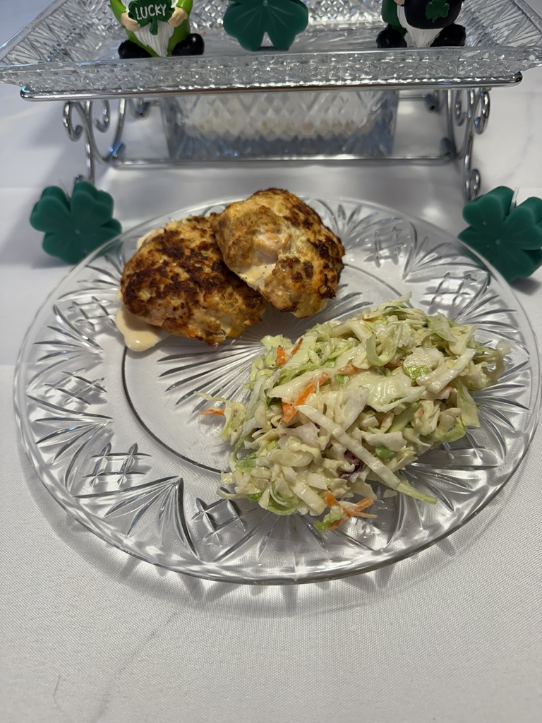 Salmon Cakes and Coleslaw on a crystal plate